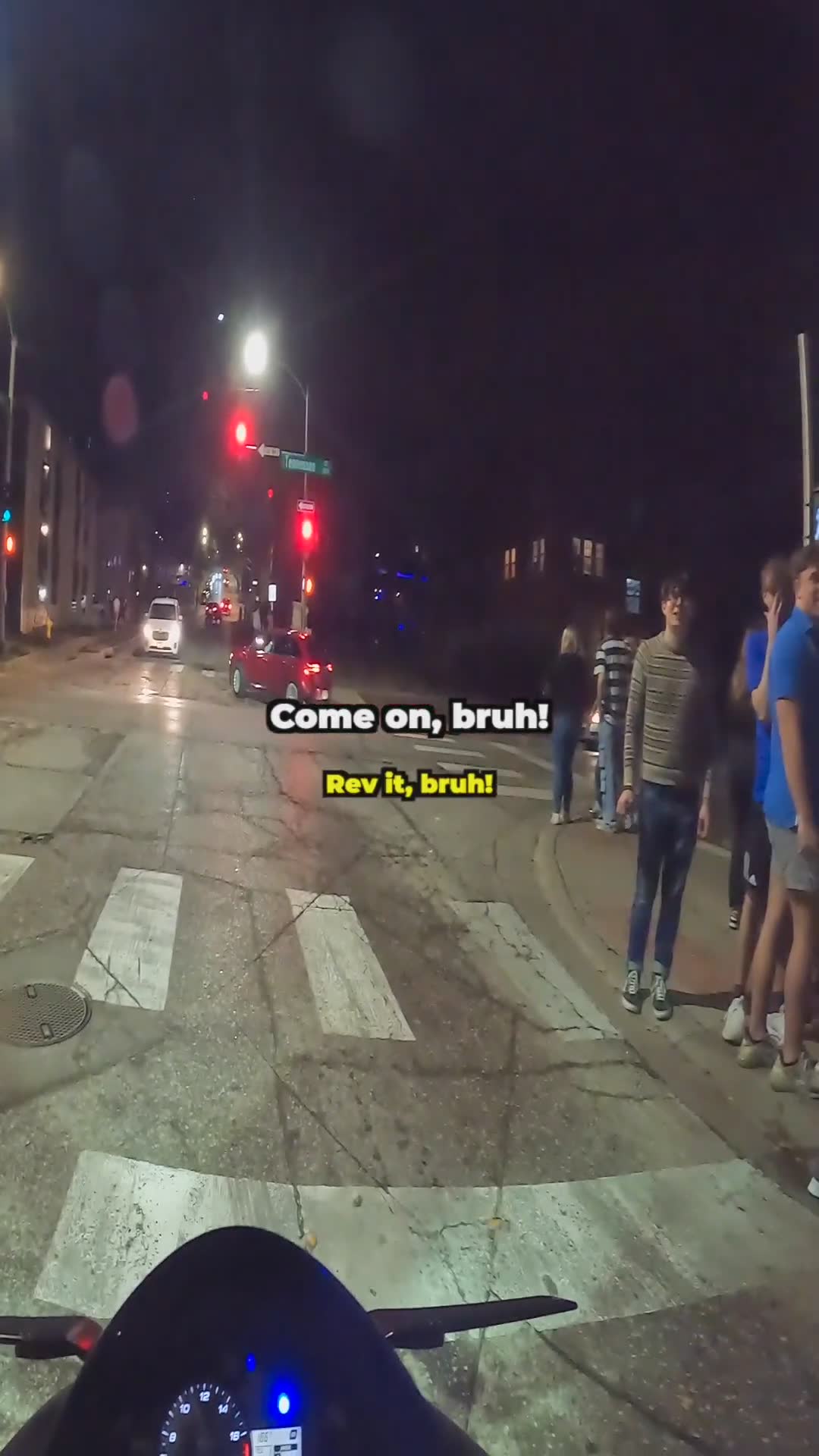 Partiers ask biker to do a wheelie